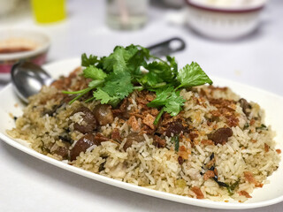 Plate of Aromatic Rice Dish with Herbs and Meat