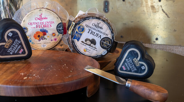 Selection of branded La Leyenda Spanish cheese and Wensleydale Vintage Reserve cheeses displayed on a wooden board at a food market or store. Ukraine, Zhytomyr, November 14, 2025