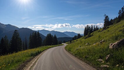Fototapeta premium Winding mountain road curves, showcasing seasonal change