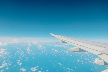 Aerial Scenic Airplane Wing and Sky View on Bright Sunny Day