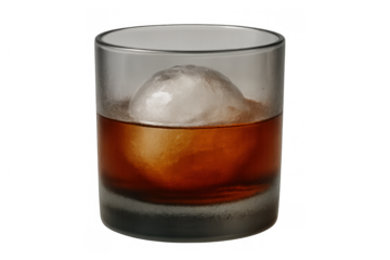 Whiskey glass containing a dark amber liquor and a single spherical ice ball, transparent background