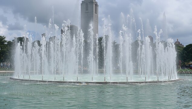Musical Dancing Fountain in a park, showcasing a vibrant water display with fireball effects and peacock spray, entertainment attraction