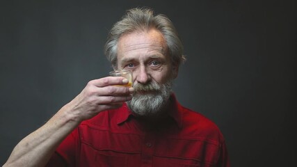 Older man in senior age eating and drinking isolated on background - Powered by Adobe