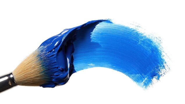 Blue paint brush stroke on a pristine white background. Artist's brush leaving a vivid blue trail, close up