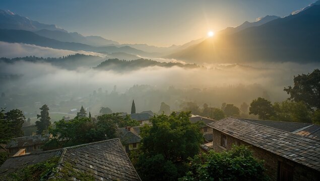 Sunrise over the mountains with a village in view, highlighting seasonal change