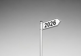 Monochromatic directional sign pointing right, with the bold number '2026' on a clear background