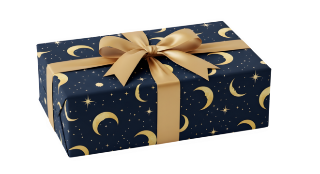 Festive gift box wrapped in dark blue celestial paper with moons and stars isolated on transparent background
