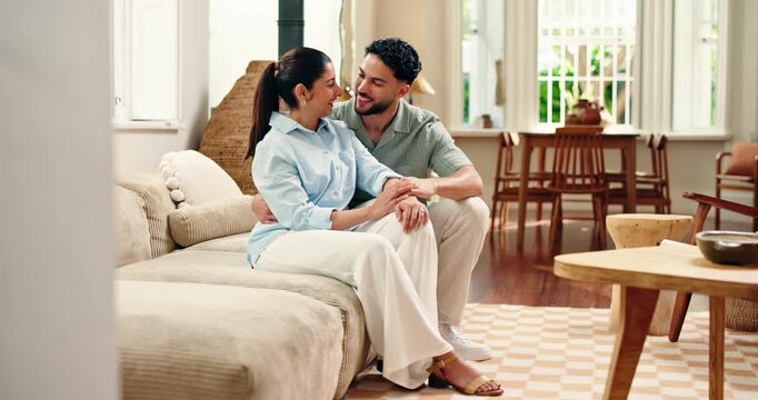 Couch, couple and kiss with smile for relax, chat together and healthy relationship in living room. Happy people, man and woman or partner for connection, love or commitment with marriage in home