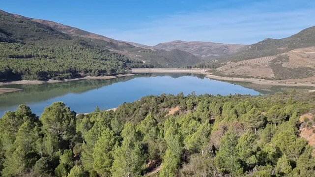 Scenic Moroccan landscape featuring Lac du Barrage Sed Nakhla dam in Zinat, nestled between Tetouan and Chefchaouen. A tranquil view of nature, water, and mountains in North Africa.