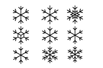 Simple black shapes of snow crystals representing winter and the holiday season
