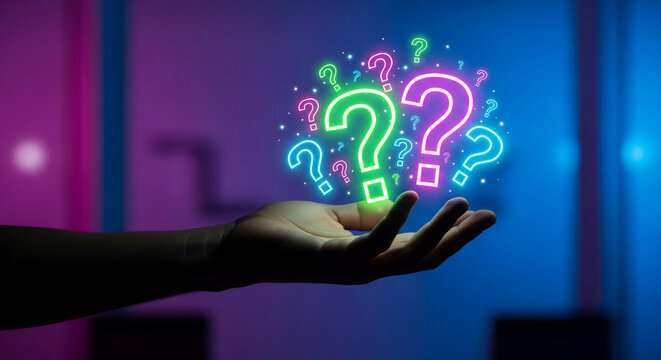 Hand holding glowing question mark, colored in pink, green, blue; representing curiosity, uncertainty and solution finding; on blurred background
