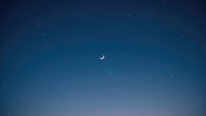 Night sky backdrop featuring a crescent moon and stars, ideal for editorial headers