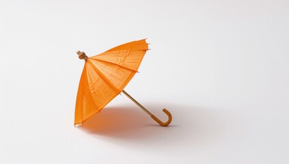 Orange Beverage with Umbrella on Plain White Surface, refreshing summer drink