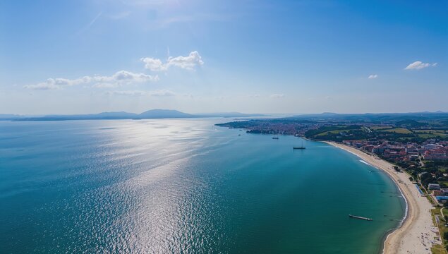 Aerial view of a coastal town with residential buildings, urban density,
