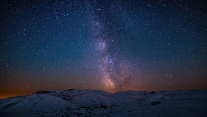Night sky over a snow-covered mountain range, showcasing the vastness of the galaxy, travel opportunity, nature exploration