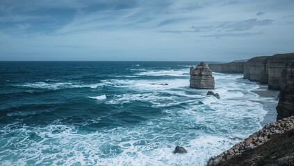 View of ocean waves crashing against a rugged shoreline, highlighting erosion risk