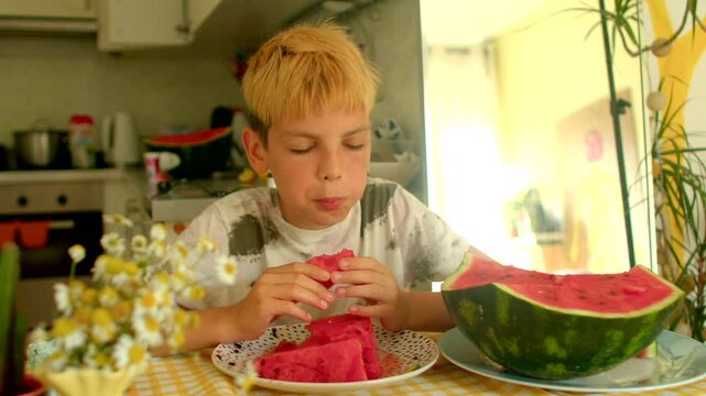 caucasian boy chomping watermelon at table, energetic bites, seeds and juice, bright kitchen backdrop, playful