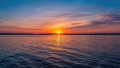 Naklejka premium Sunset over the Voronezh reservoir reflecting on the water, summer evening tranquility