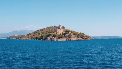 Fototapeta premium Scenic view of a historic fortress by a vibrant blue sea, summer travel, preservation