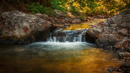 Flowing water cascading over rocky riverbed, showcasing erosion risk
