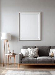 Interior scene of a modern living room with a blank framed art hanging above a gray couch