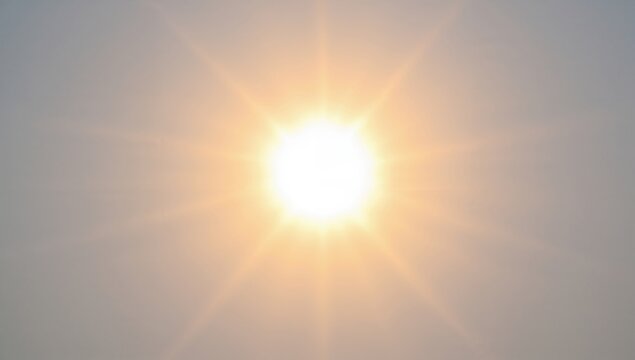 Summer landscape featuring a brilliant sunburst with lens flare, ideal for editorial backgrounds
