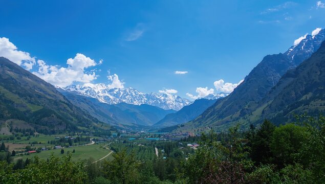 The majestic Sonamarg valley under a clear blue sky, showcasing natural beauty and seasonal change