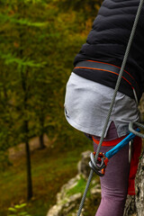 Close-up. Via ferrata. An unidentified person climbs in the mountains  with the help of fixed safety ropes. Krakow-Czestochowa Upland, Poland