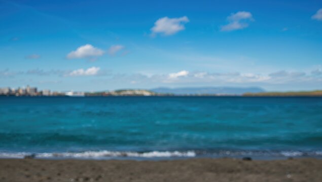 The serene beach with a tranquil sea and blue sky, ideal for relaxation and contemplation