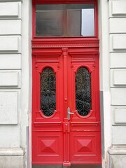Red old beautiful door to the front door in Prague