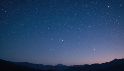 Fototapeta premium Starry night sky above mountains with blue gradient hue