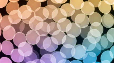 Beautiful abstract background blurred circular bokeh lights create smooth multicolored spectrum gradient transitioning from warm to cool tones