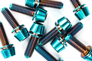 Blue titanium hexagonal bolts on a white background