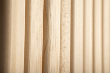 A background of vertical strips of natural wood in warm color