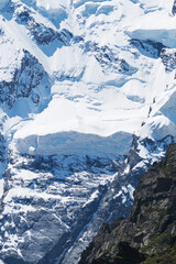 Snow-capped peaks with lots of snow and dangerous avalanches