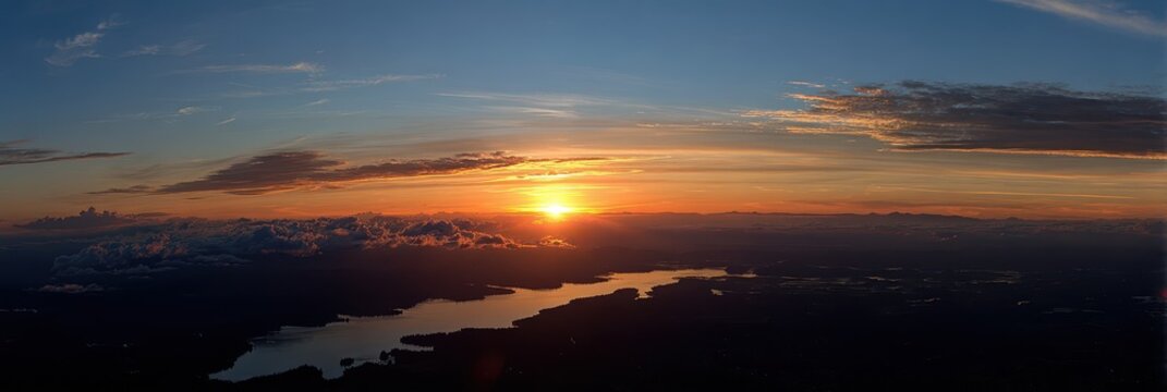 Aerial View of Lake Stevens at Sunset: Vibrant Sky with Orange Hues and Soft Clouds