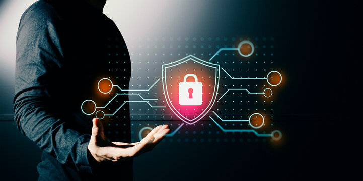 hand of businessman interactive touching a holographic anti-virus security shield system network and technology, success of trading innovation