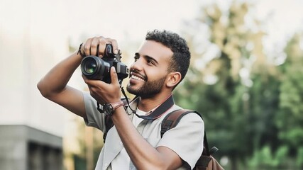 Enthusiastic photographer with a camera in nature, capturing the perfect shot outdoors