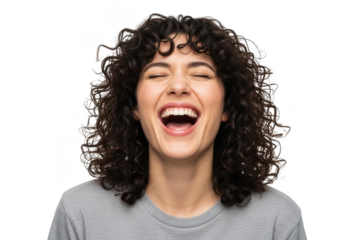Joyful young woman with curly dark hair and a wide open mouth laugh isolated on transparent background