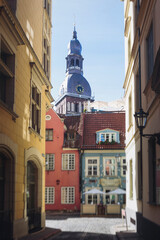 Fototapeta premium Riga Old Town view, Latvia, streets of Vecriga historical center with Town Hall square, House Of The Black Heads, Cathedral and church, travel to Latvia and Baltic States, summer day with a blue sky
