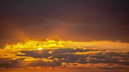 A view of golden sunlight piercing through dark clouds during a vibrant sunset in the sky above - Powered by Adobe