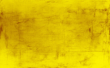 Industrial textured background in yellow and gold with worn-out surface. 