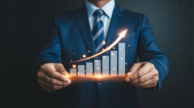 Businessman holding a glowing orange bar graph with rising arrow, symbolizing financial growth, business success, performance improvement, data analytics, and futuristic economic progress.