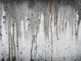 grey concrete texture with wet trickles after rain
