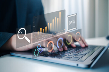 Hands interact with a futuristic data visualization interface on a laptop. This concept illustrates Artificial Intelligence, Big Data analysis, Business Intelligence, and financial strategy planning.