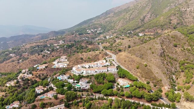 Aerial landscape view of Sierra de Mijas
Mountains. Mijas is a municipality in the Province of Málaga, in the autonomous community of Andalusia, Spain. Ambient Drone Landscape Exploration.