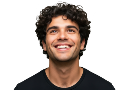 A young man with curly dark hair and a bright genuine smile looking upwards with joy and optimism isolated on transparent background