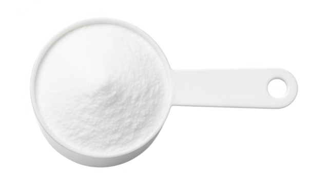 Close-up of a white measuring spoon filled with fine white powder on a white background, kitchen utensil used for cooking and baking, minimalistic