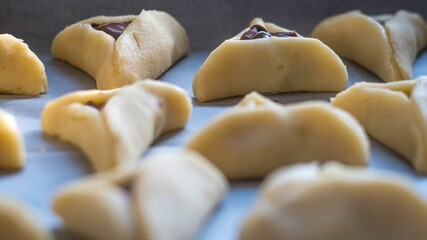 High resolution close up color image of the preparation of fresh homemade Hamantaschen for the Jewish Purim Holiday