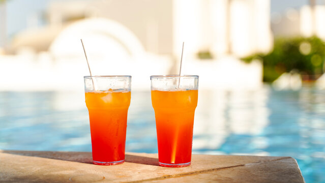 Two cocktails by the beach by the pool